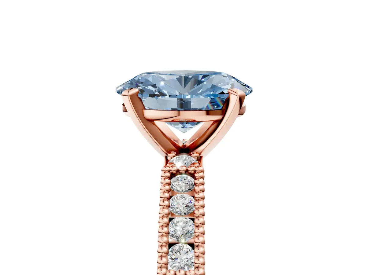 Fancy Blue Oval Cut Solitaire with Pavé Band and Four-Prong Setting Rose gold
