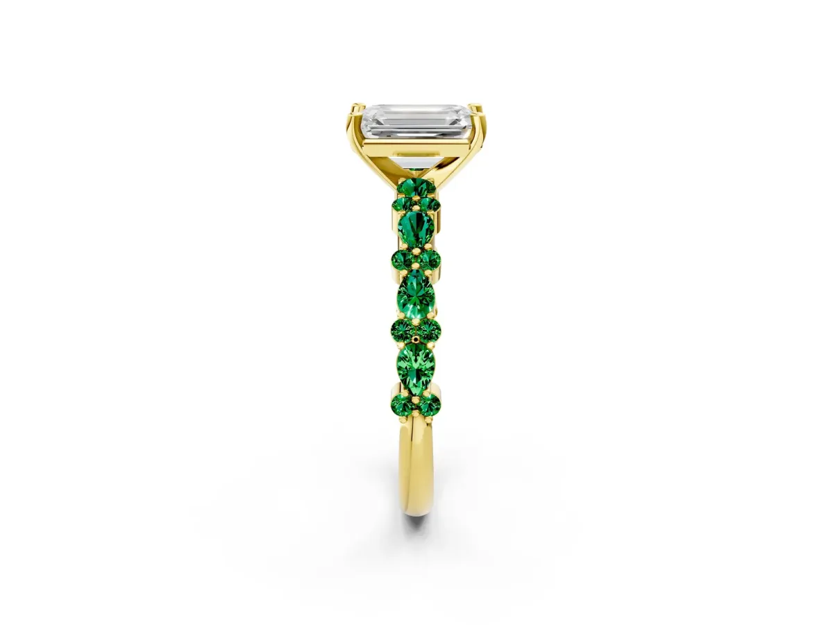 Emerald Cut Diamond Side Stone Solitaire Ring with Round Emerald and Four-Prong Setting Yellow gold