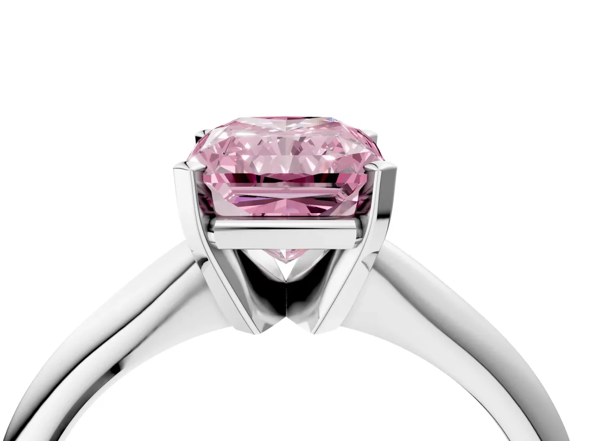 Fancy Pink Radiant Cut Cut Solitaire Ring with Four-Prong Setting on a Classic Band Platinum