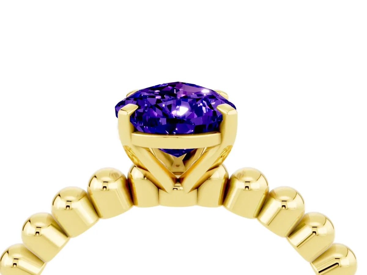 Pear Cut Tanzanite Solitaire Ring with Beaded Band and Prong Setting Yellow gold