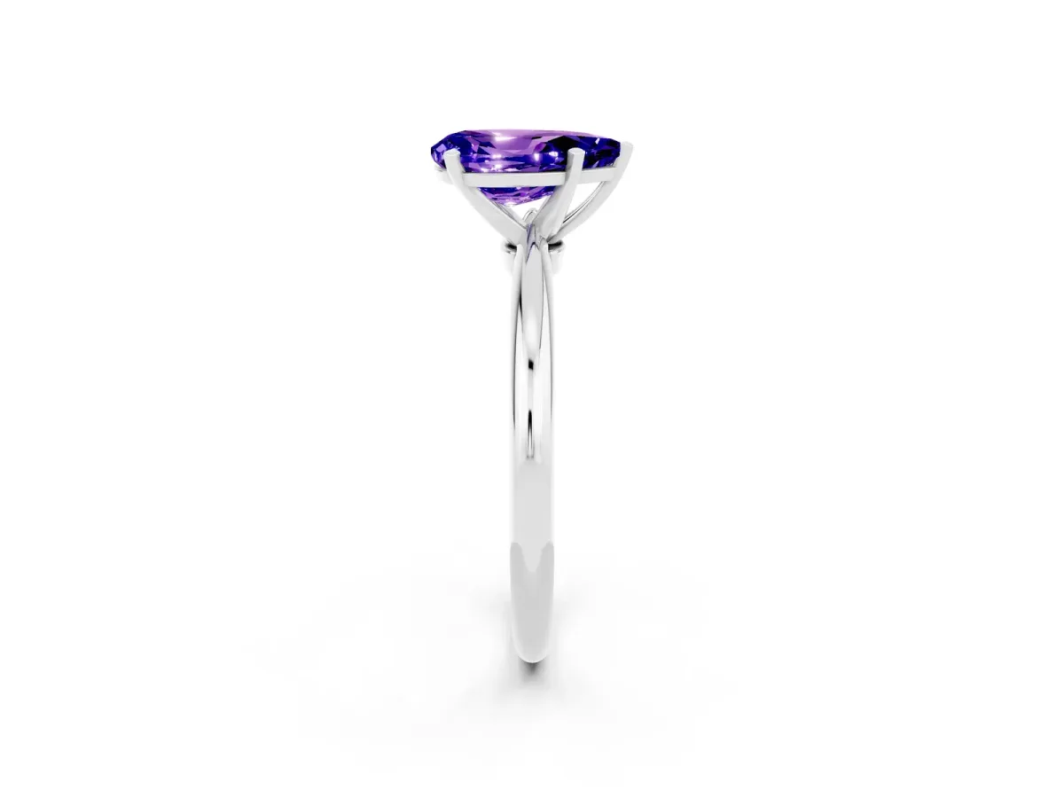 Pear Cut Tanzanite Solitaire Ring with Six-Prong Setting and Classic Band Silver