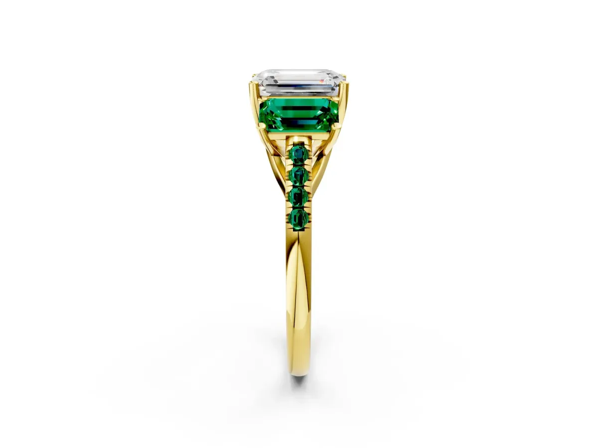 Three-Stone Emerald Cut Diamond Ring with Round Emerald Pavé Band and Prong Setting Yellow gold
