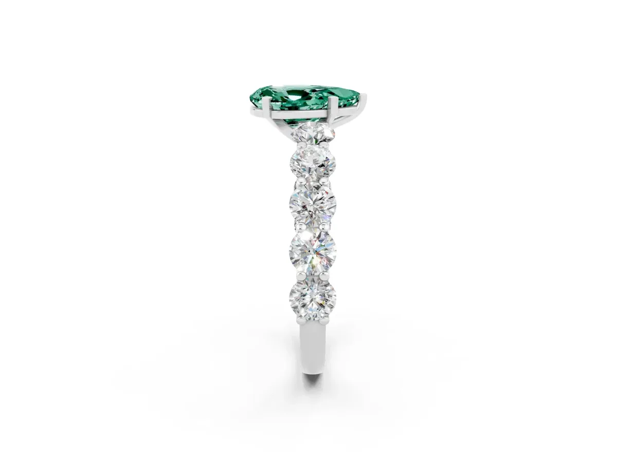 Pear Cut Green Sapphire Prong Setting with Side Stones on a Pave Band Silver
