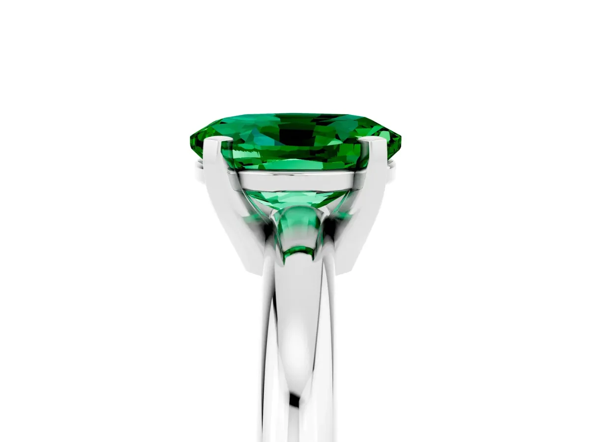 Oval Cut Emerald Solitaire Engagement Ring with Round Band and Four-Prong Setting Silver