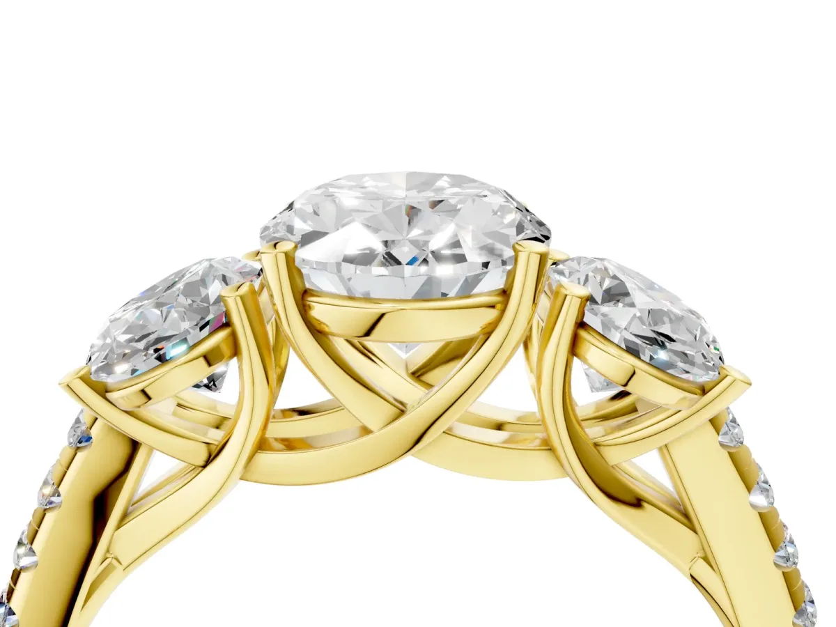 Three-Stone Oval Cut Diamond Ring with Round Pavé Band and Prong Setting Yellow gold