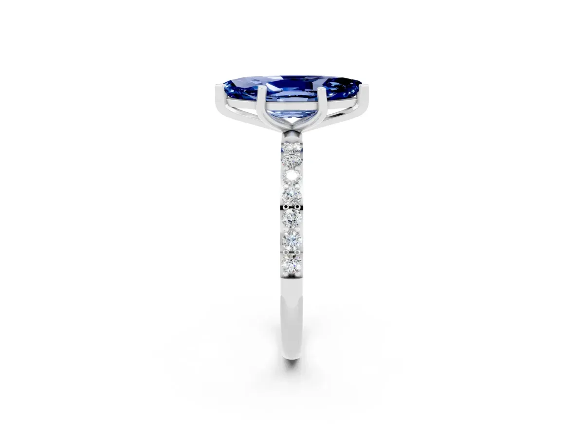 Marquise Cut Blue Sapphire Solitaire Ring with Round Pavé Band and Prong Setting Silver