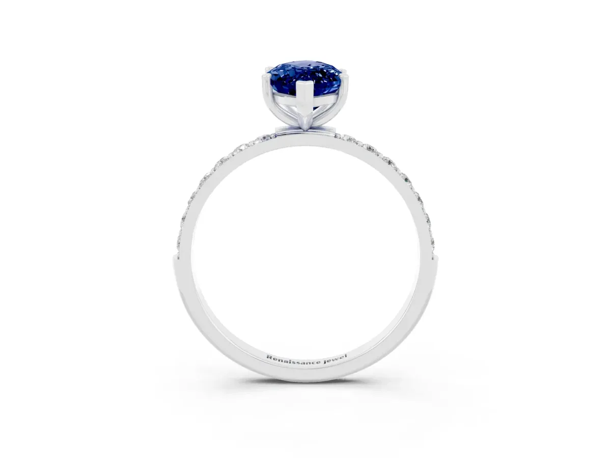 Marquise Cut Blue Sapphire Solitaire Ring with Round Pavé Band and Prong Setting Silver