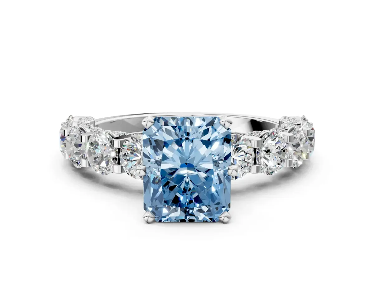 Fancy Blue Radiant Cut Diamond Side Stone Engagement Ring with Four-Prong Setting Silver