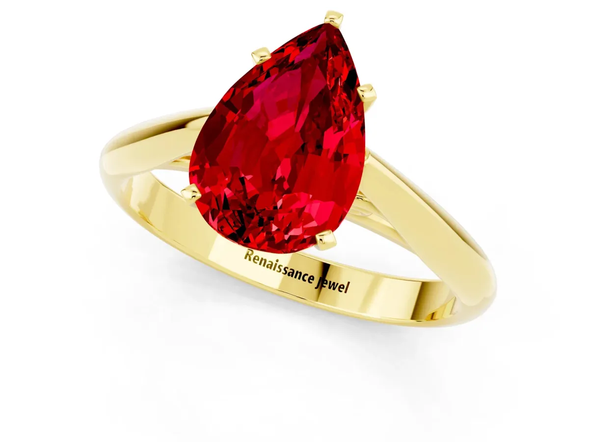 Pear Cut Ruby Solitaire Engagement Ring with Cathedral Setting and Four-Prong Mount Yellow gold