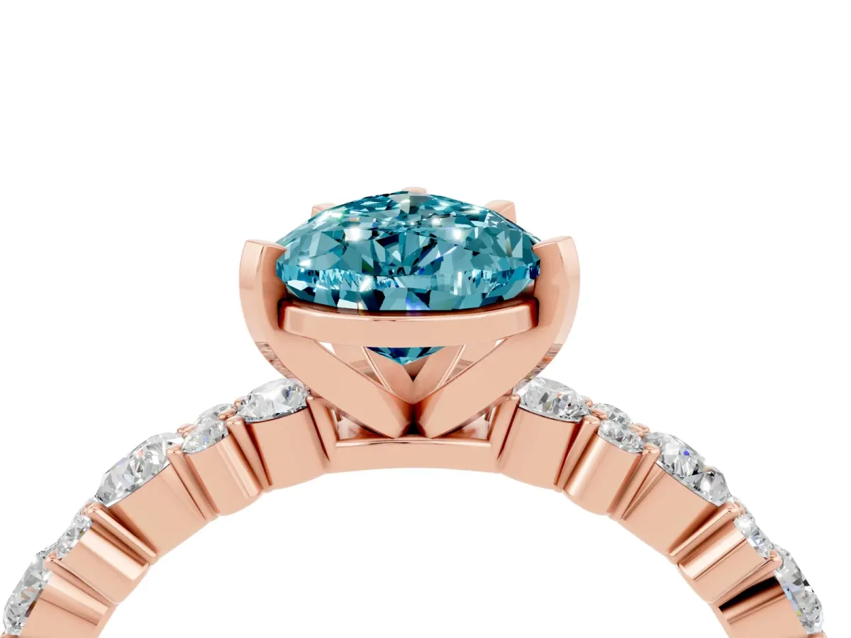 Pear Cut Blue Topaz Side Stone Solitaire Ring with Round and Four-Prong Setting Rose gold