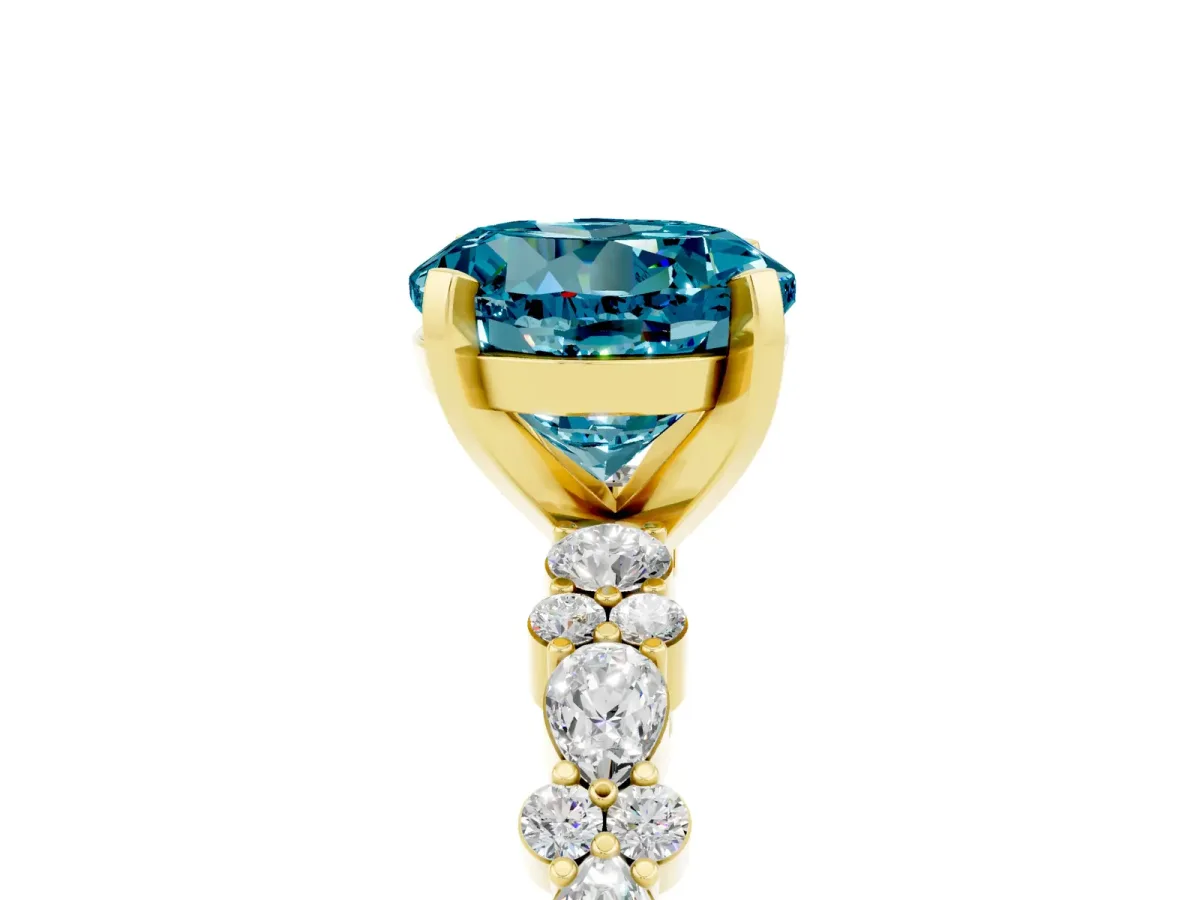 Round Cut Blue Topaz Side Stone Solitaire Ring with Round and Four-Prong Setting Yellow gold