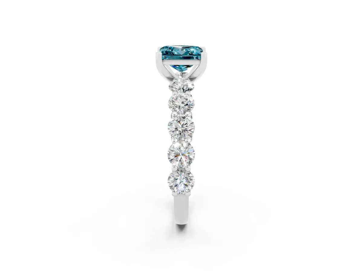 Princess Cut Blue Topaz Prong Setting with Side Stones on a Pave Band Silver
