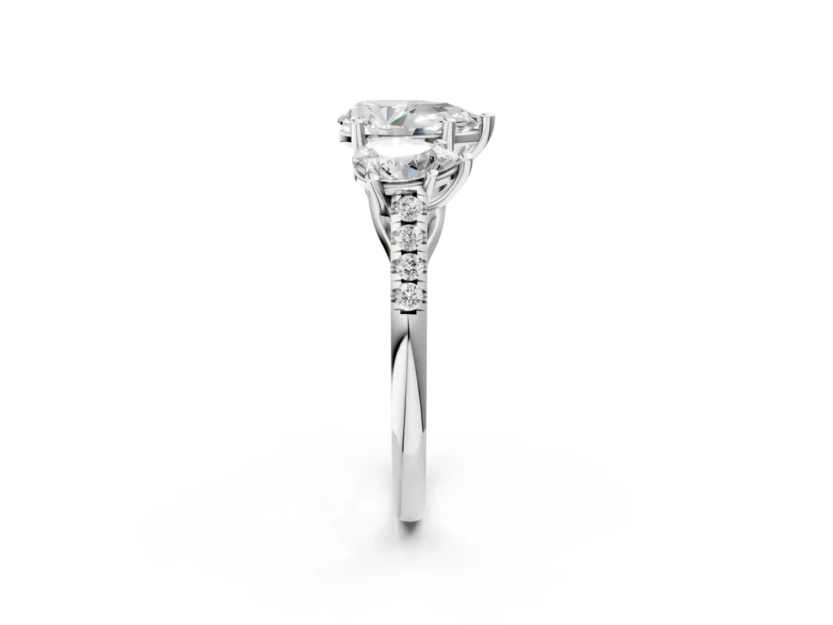 Three-Stone Pear Cut Diamond Ring with Round Moissanite Pavé Band and Prong Setting Platinum