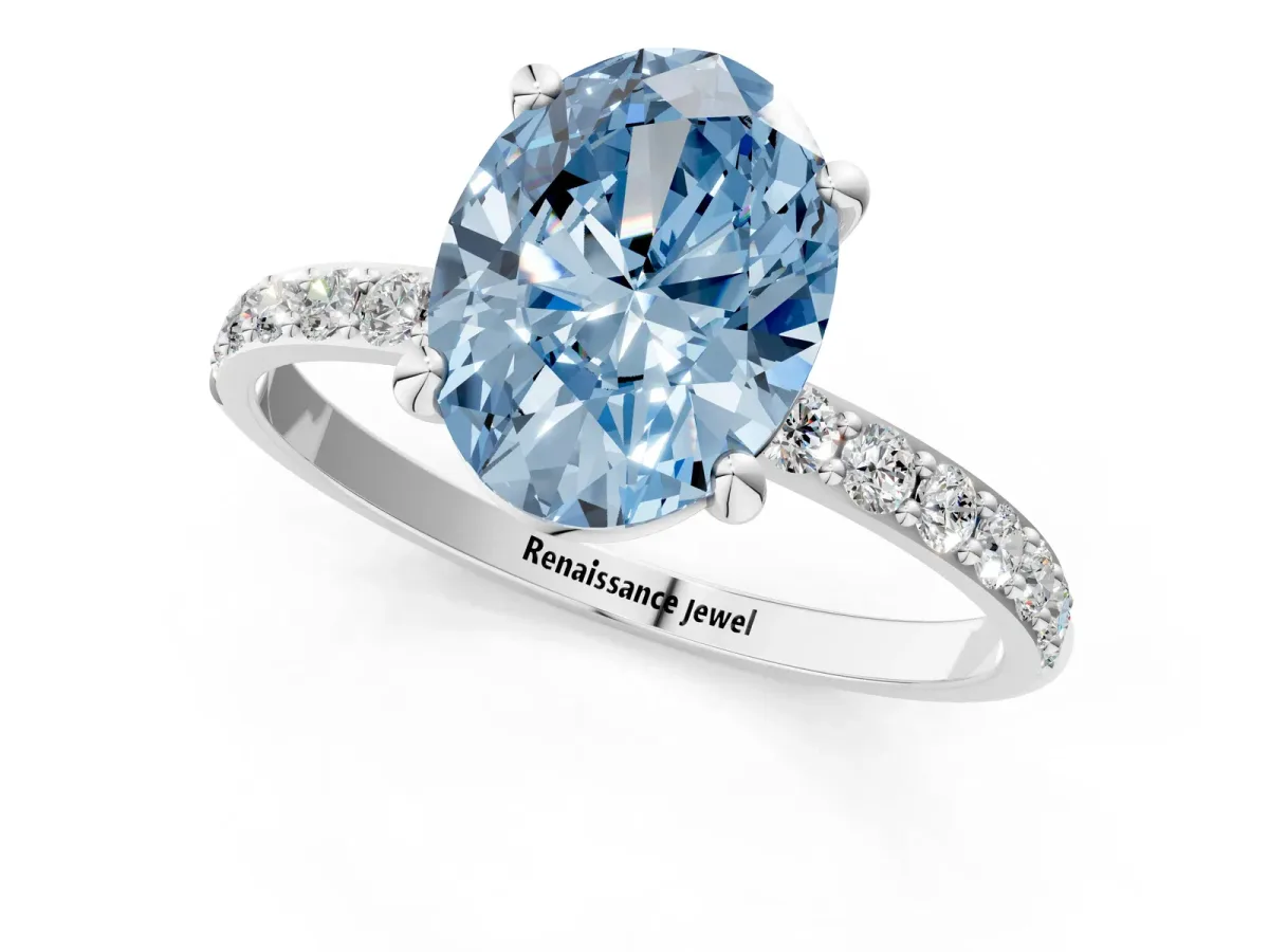 Fancy Blue Oval Cut Diamond Solitaire Ring with Round Pavé Band and Prong Setting Platinum