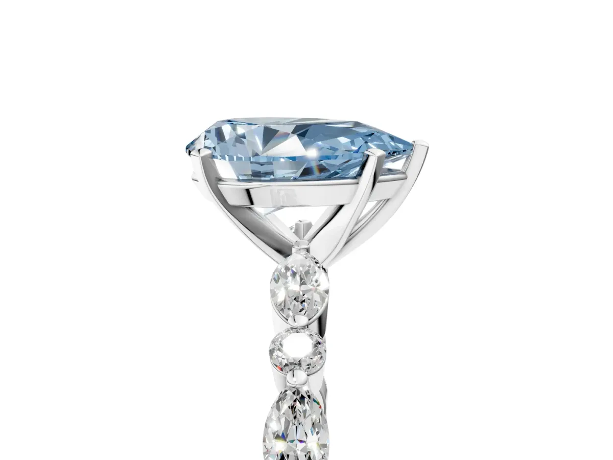 Fancy Blue Pear Cut Diamond Ring with Marquise and Round Side Stones and Four-Prong Setting Silver