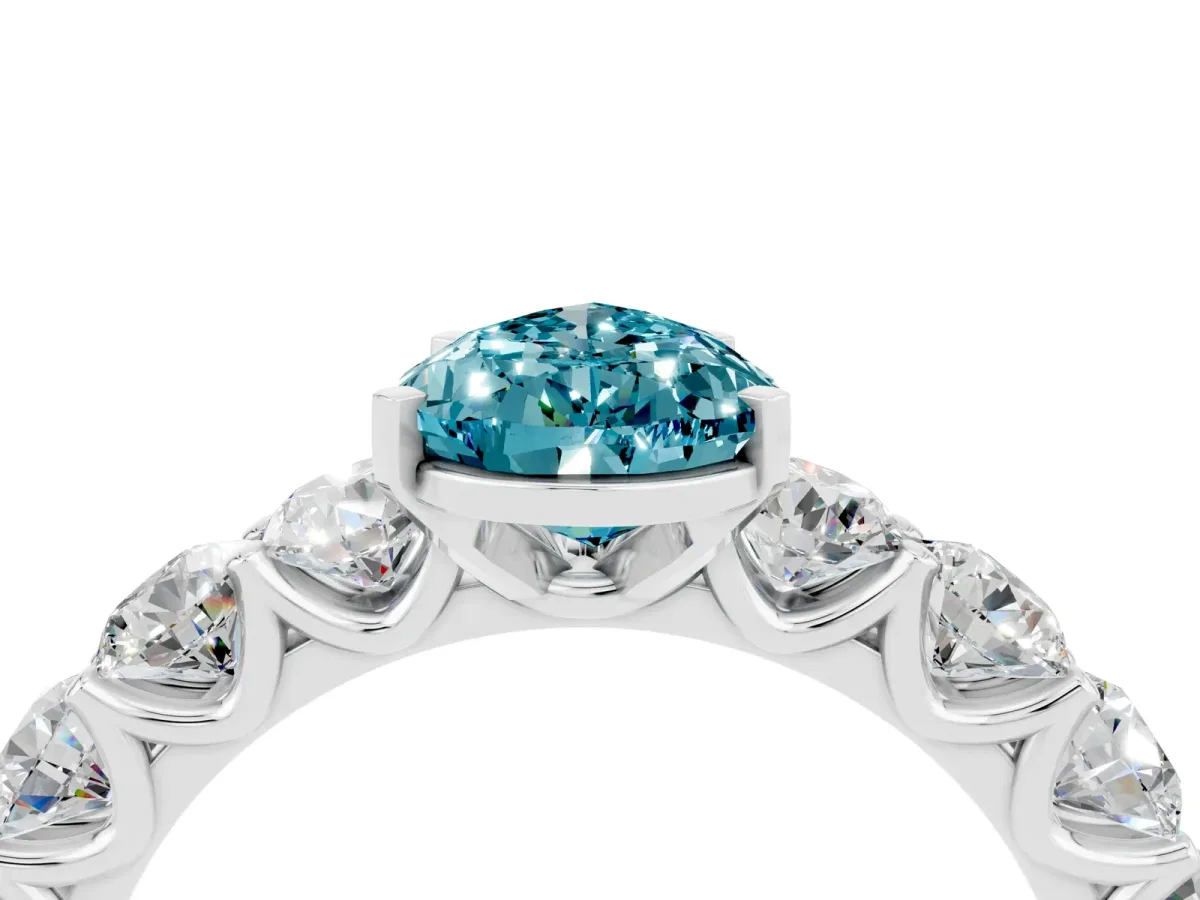 Pear Cut Blue Topaz Prong Setting with Side Stones on a Pave Band Silver
