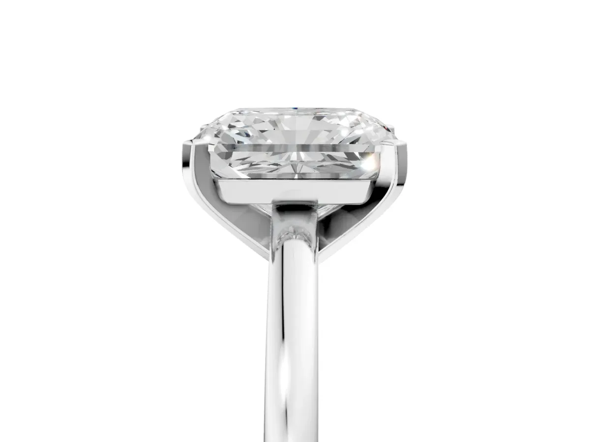 Radiant Cut Solitaire Diamond Engagement Ring with Four-Prong Setting on a Classic Band Platinum