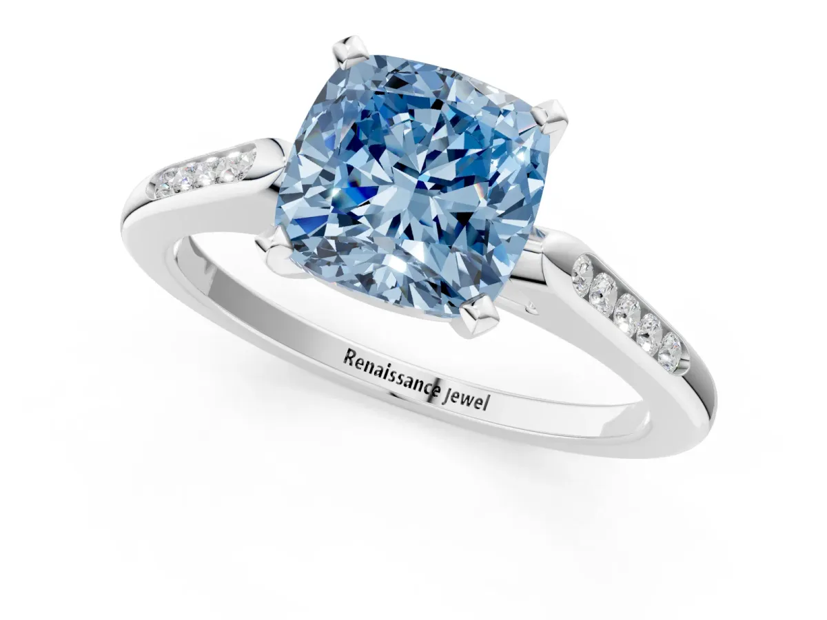 Fancy Blue Cushion Cut Diamond Solitaire Ring with Channel Set Round Band and Prong Setting Silver