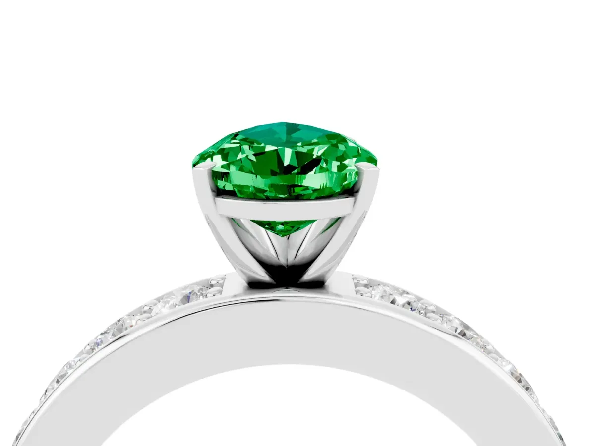 Pear Cut Emerald Engagement Ring with Channel Set Round Band and Prong Setting White gold