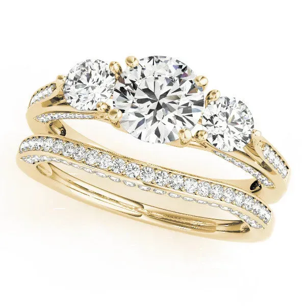 Round Cut Brilliant Three-Stone Engagement Ring with Split Shank and Prong Setting Yellow gold