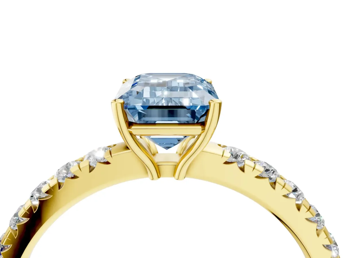 Fancy Blue Emerald Cut Diamond Pavé Solitaire Engagement Ring with Four-Prong Setting Yellow gold