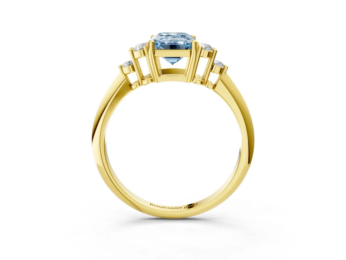 Fancy Blue Emerald Cut Cut Diamond Cluster Ring with Solitaire Band and Four-Prong Setting Yellow gold