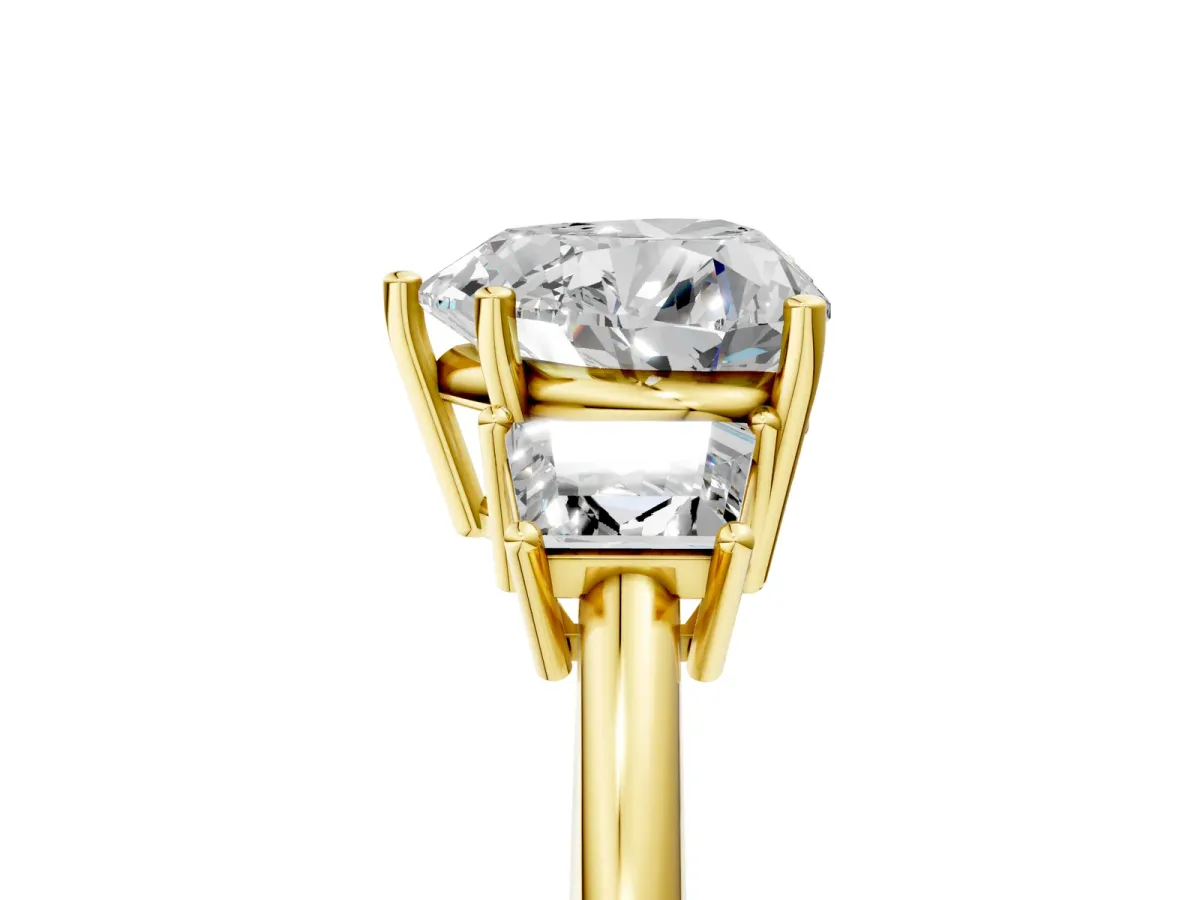 Heart Cut Diamond Three-Stone Ring with Trapezoid Side Stones and Prong Setting Yellow gold