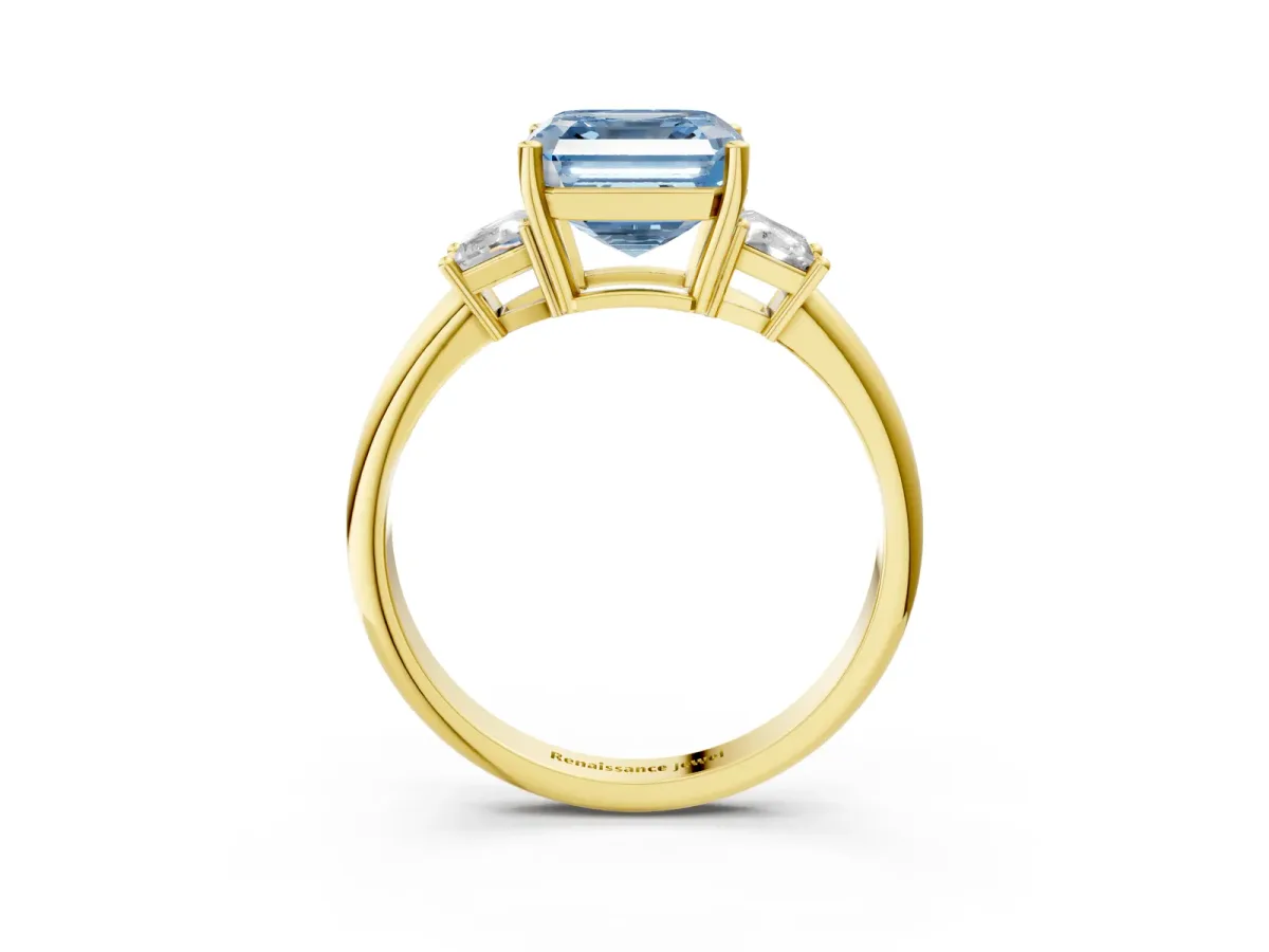 Fancy Blue Asscher Cut Diamond Three-Stone Ring with Trapezoid Side Stones and Prong Setting Yellow gold