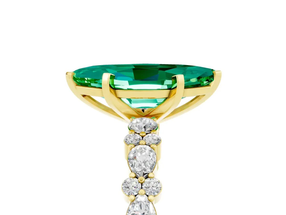 Marquise Cut Emerald Side Stone Solitaire Ring with Round and Four-Prong Setting Yellow gold