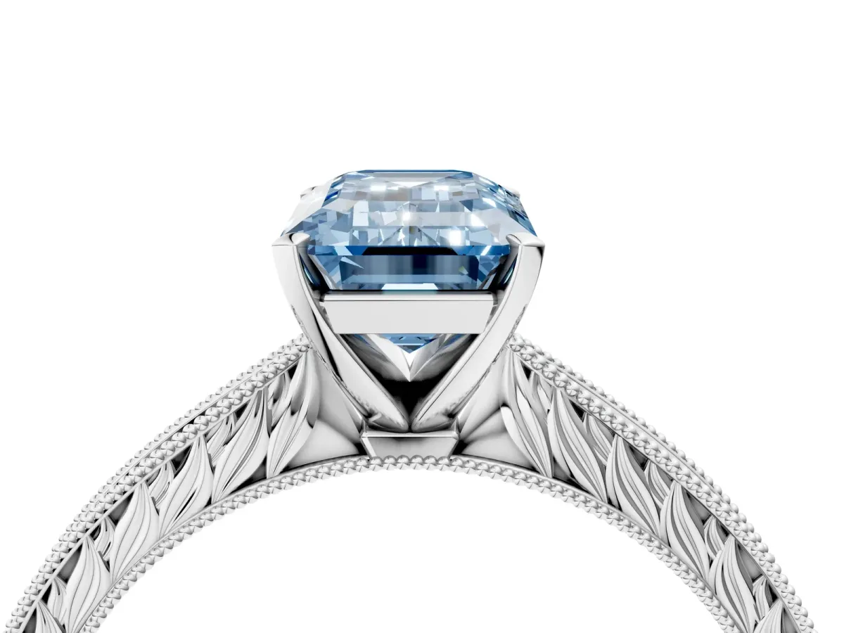 Fancy Blue Emerald Cut Solitaire Milgrain Engraved Band with Four-Prong Setting White gold