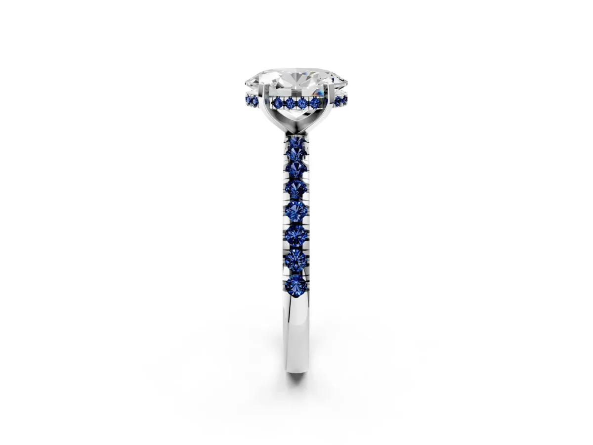 Oval Cut Diamond Solitaire Ring with Round Blue Sapphire Pavé Band and Four-Prong Setting Silver