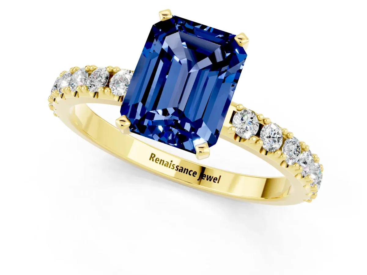 Emerald Cut Blue Sapphire Solitaire Pavé Band with Four-Prong Setting Yellow gold