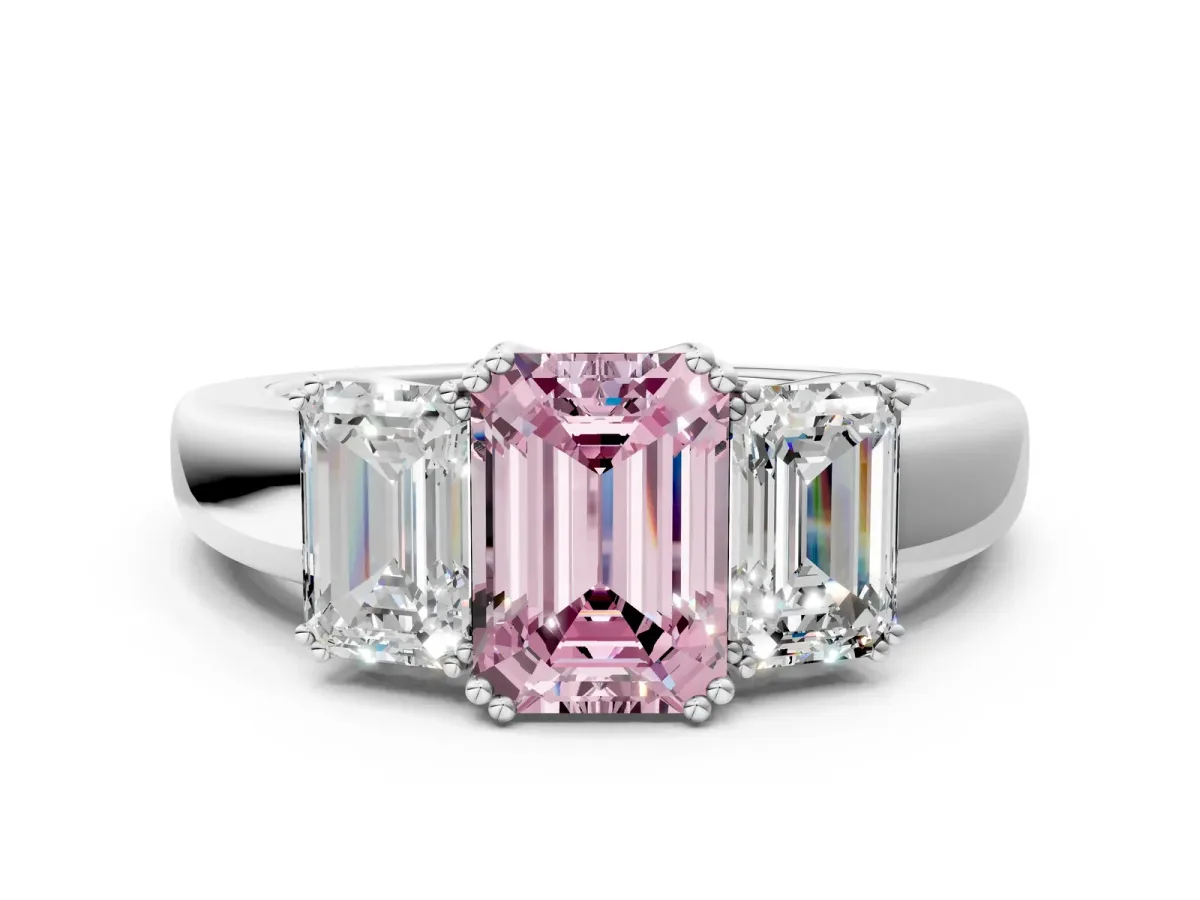 Fancy Pink Three-Stone Emerald Cut Cut Diamond Ring with Channel Set Band and Four-Prong Setting Silver