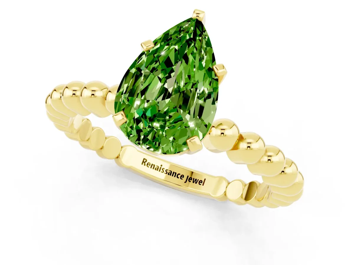 Pear Cut Peridot Solitaire Ring with Beaded Band and Prong Setting Yellow gold
