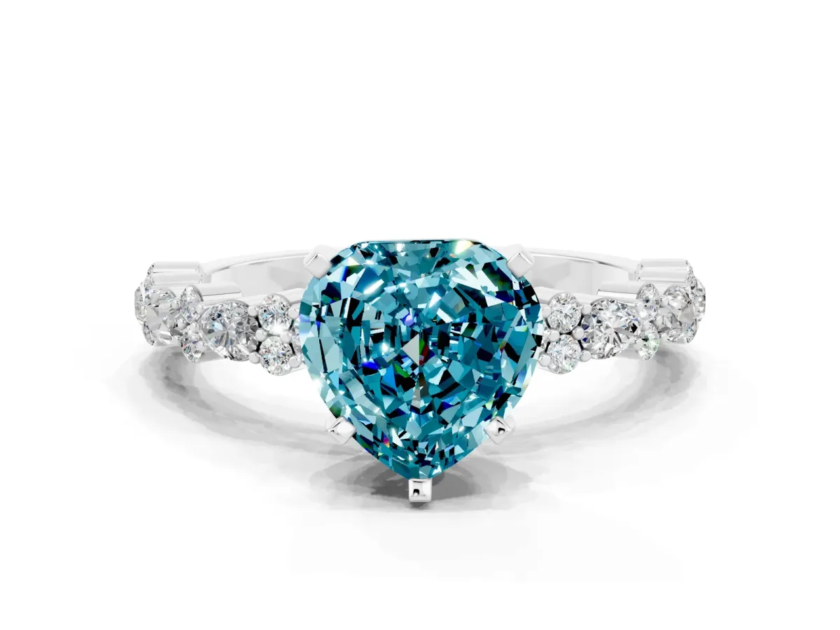 Heart Cut Blue Topaz Side Stone Solitaire Ring with Round and Four-Prong Setting Silver