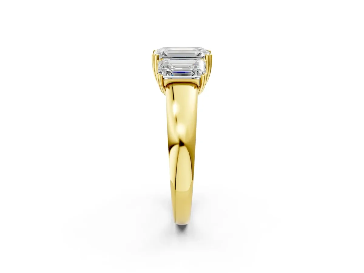 Three-Stone Emerald Cut Cut Diamond Ring with Channel Set Band and Four-Prong Setting Yellow gold