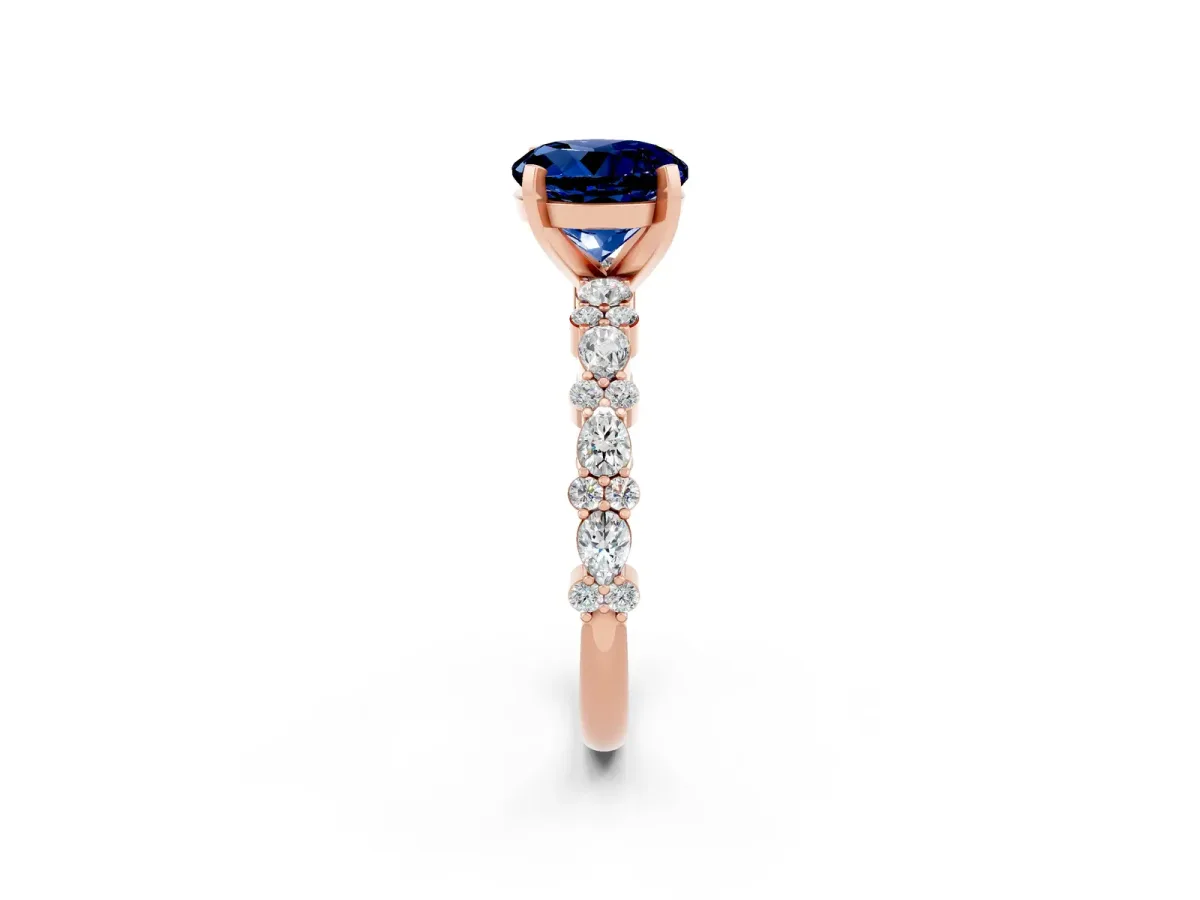 Round Cut Blue Sapphire Side Stone Solitaire Ring with Round and Four-Prong Setting Rose gold