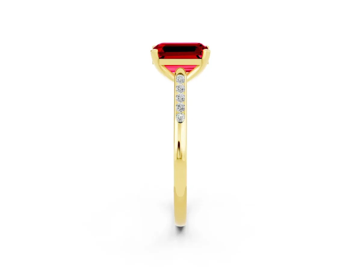 Emerald Cut Ruby Solitaire Ring with Channel Set Round Band and Prong Setting Yellow gold