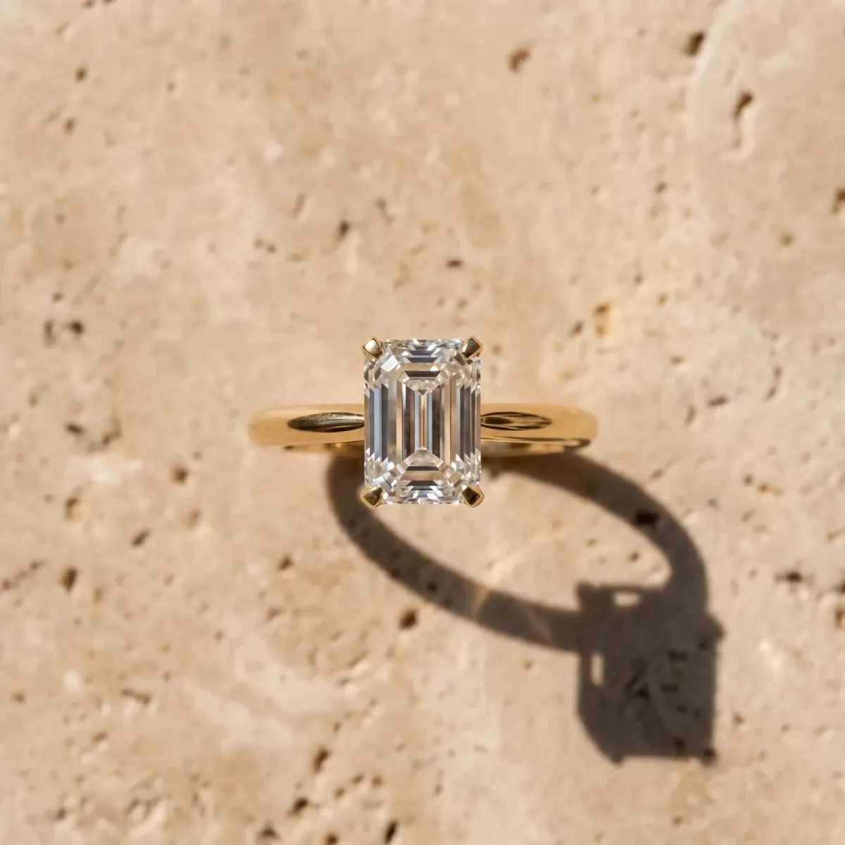 Emerald Cut Diamond Solitaire Ring with Six-Prong Setting and Classic Band Yellow gold