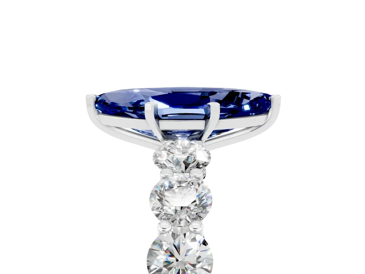 Marquise Cut Blue Sapphire Prong Setting with Side Stones on a Pave Band Silver