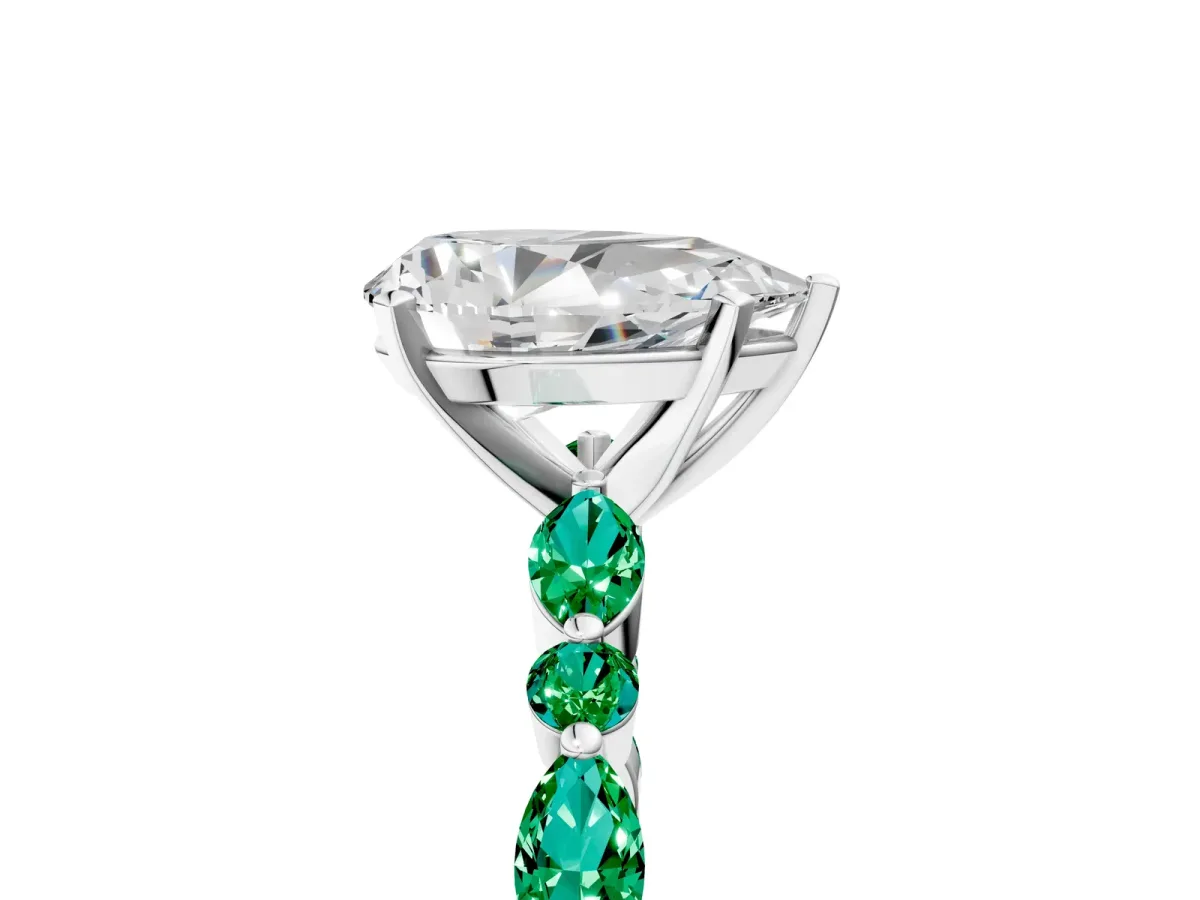 Pear Cut Diamond Ring with Marquise and Round Emerald Side Stones and Four-Prong Setting Silver