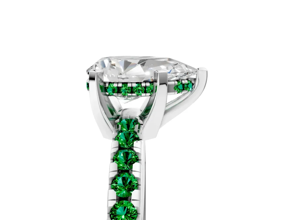 Pear Cut Diamond Solitaire Ring with Round Emerald Pavé Band and Four-Prong Setting Silver
