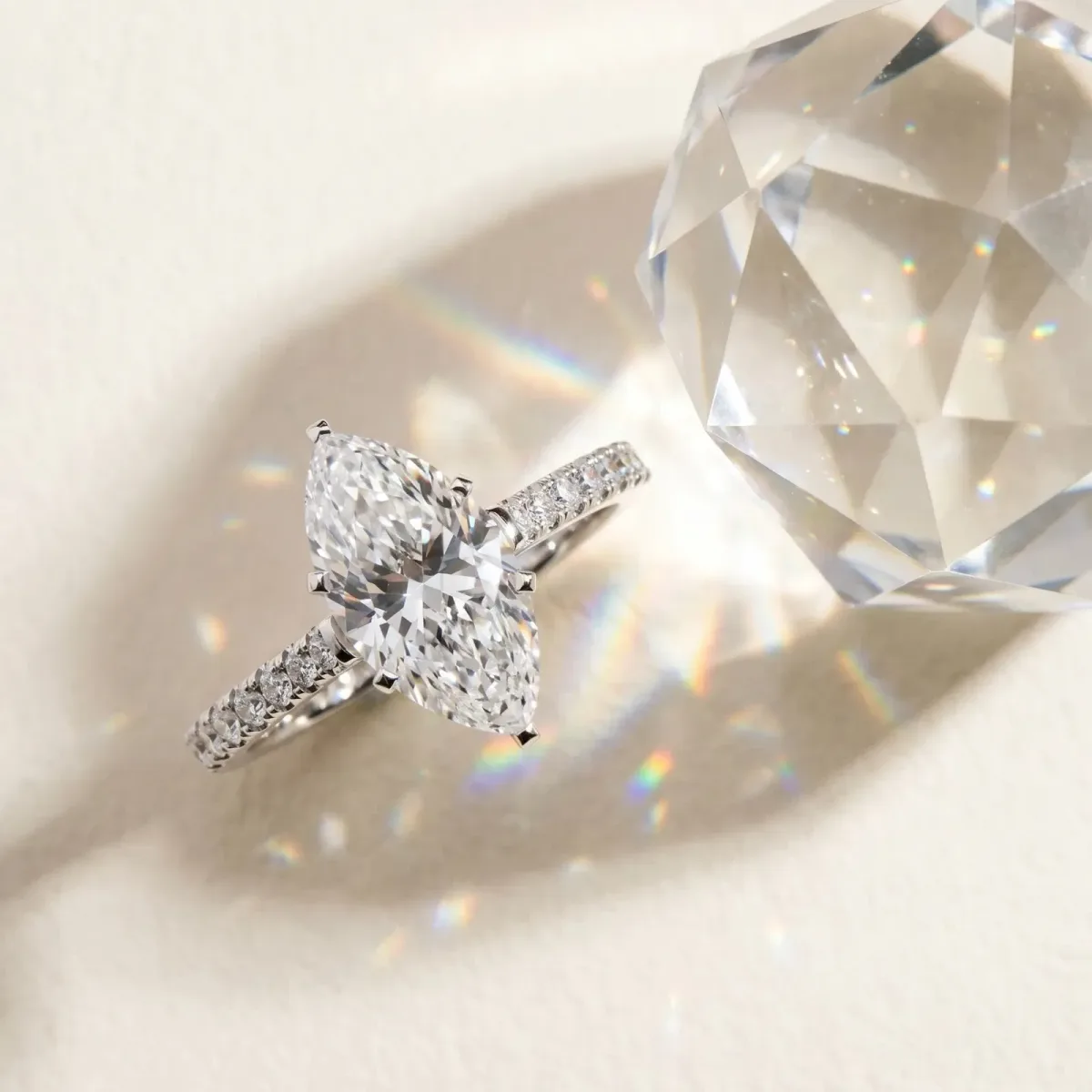Marquise Cut Cut Solitaire Diamond Engagement Ring with Pave Band and Four-Prong Setting Silver