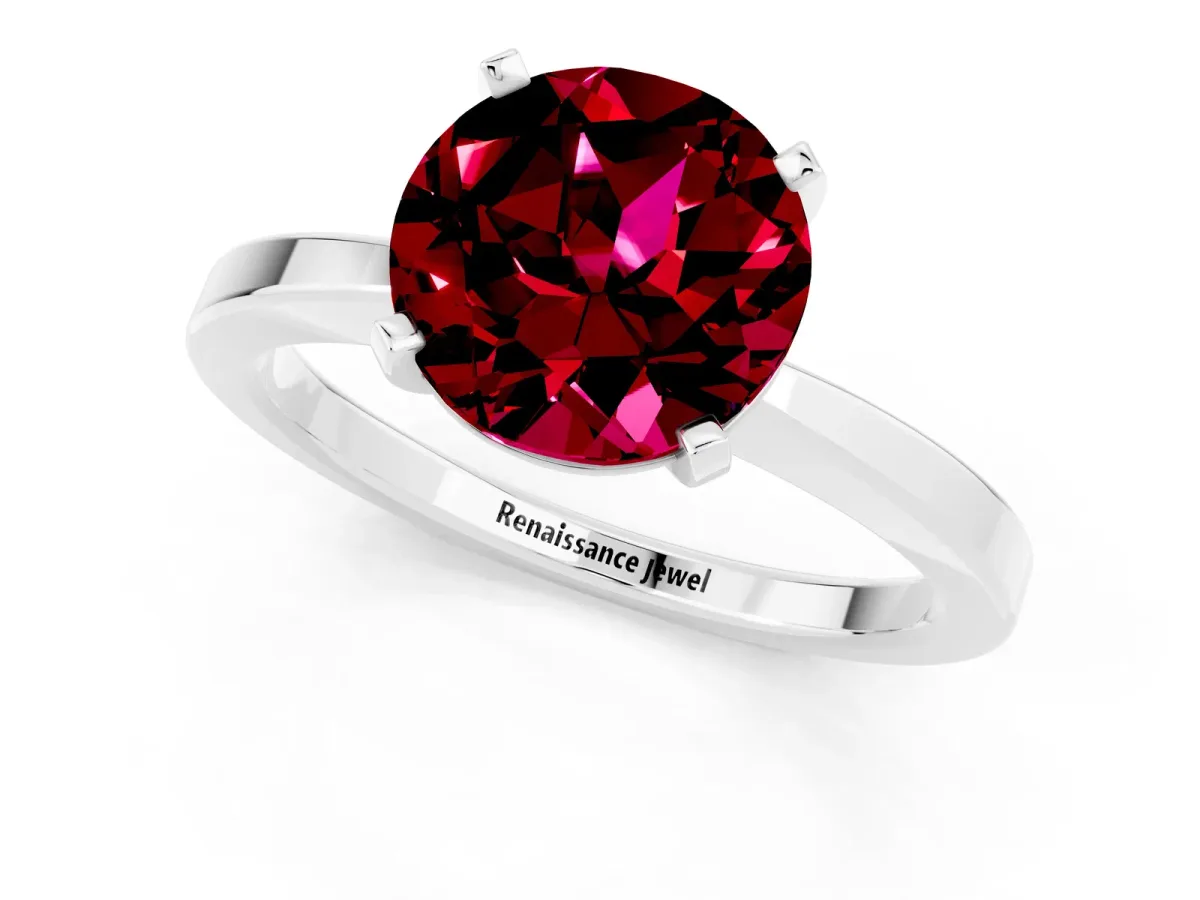 Round Cut Garnet Solitaire Engagement Ring with Classic Band and Four-Prong Setting Silver