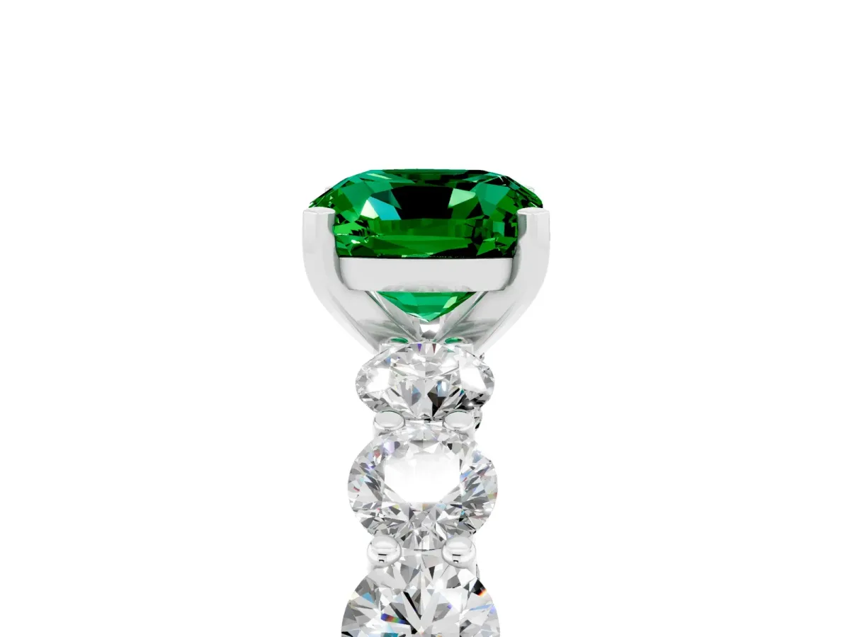 Cushion Cut Emerald Prong Setting with Side Stones on a Pave Band Platinum