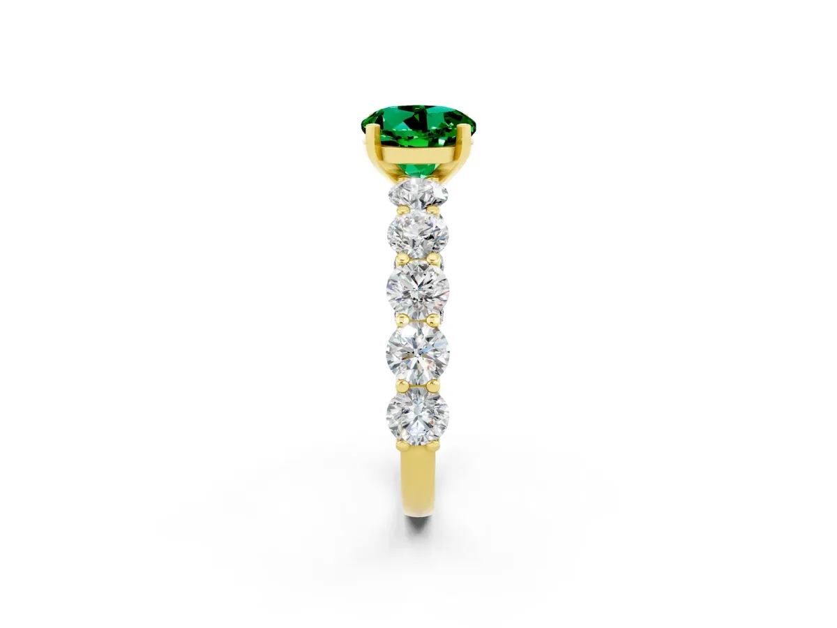 Round Cut Emerald Prong Setting with Side Stones on a Pave Band Yellow gold