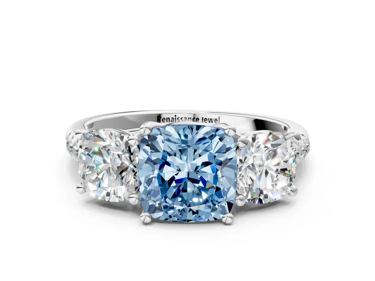 Fancy Blue Three-Stone Cushion Cut Diamond Ring with Round Pavé Band and Prong Setting Platinum