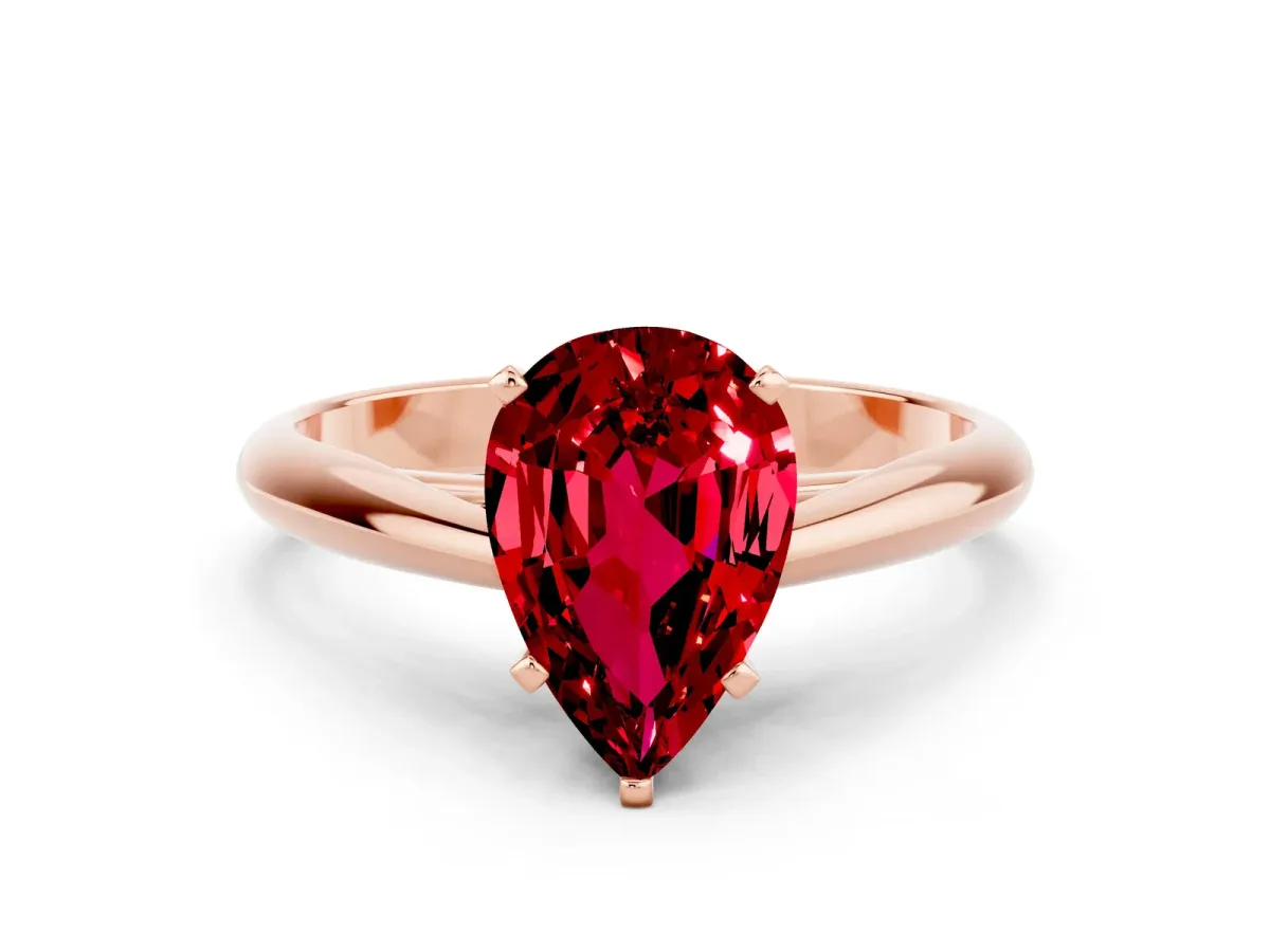 Pear Cut Ruby Solitaire Engagement Ring with Cathedral Setting and Four-Prong Mount Rose gold