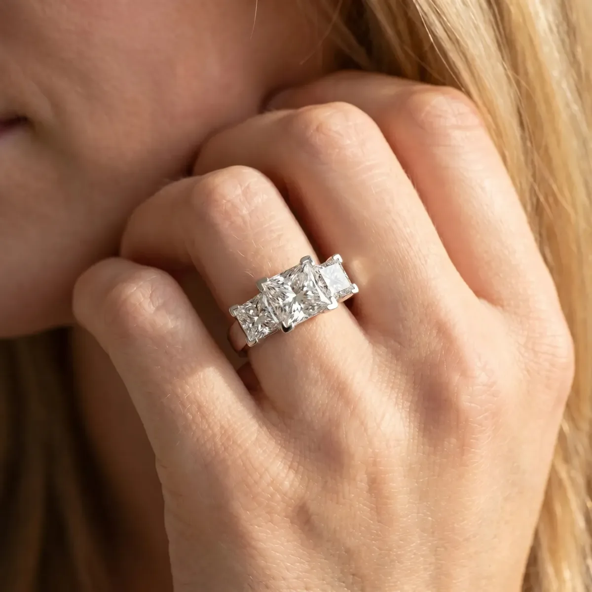 Three-Stone Princess Cut Cut Diamond Ring with Channel Set Band and Four-Prong Setting Platinum