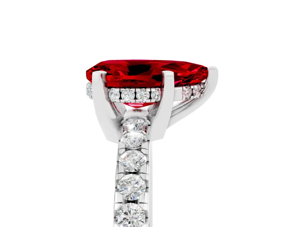 Pear Cut Ruby Solitaire Ring with Round Pavé Band and Four-Prong Setting Platinum
